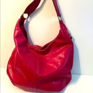 Hobo brand handbag in fushia leather